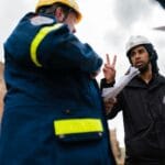 تصميم مخططات الدفاع المدني واعتمادها man in black jacket standing beside woman in yellow jacket